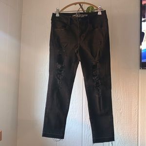 American Eagle. Super super stretch distressed black denim jeans. Size 8R.